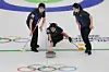 Kim Min-ji delivers a stone during the women’s curling round-robin match against China at the 2026 Milan-Cortina Winter Olympics, held at the Cortina Curling Olympic Stadium in Cortina d’Ampezzo, Italy, on Feb. 16. [YONHAP]