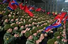 North Korean soldiers clap during a youth parade at Kim Il Sung Square in Pyongyang on Jan. 18, in this photo carried by the state-run Rodong Sinmun. [NEWS1]