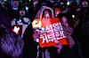 Protesters wave K-pop light sticks during a rally calling for President Yoon Suk Yeol's impeachment in Yeouido, Seoul, on Saturday. [JOONGANG ILBO]