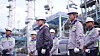 Former Lotte Chemical CEO and President Lee Hun-ki, center, and firm employees examine the construction site of a petrochemical complex in Indonesia on April 23, 2024. [YONHAP]