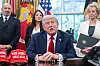 U.S. President Donald Trump speaks to media after signing executive orders related to higher education, alongside U.S. Commerce Secretary Howard Lutnick, left, and Education Secretary Linda McMahon in the Oval Office of the White House in Washington on April 23. [AFP/YONHAP]