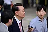 Former President Yoon Suk Yeol speaks to reporters as he leaves the Seoul Central District Court in Seocho District, southern Seoul, on June 9, after attending the sixth hearing in his trial on charges of leading a rebellion and abuse of power. [JOINT PRESS CORPS]