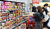 Customers buy ramyeon at a supermarket in Seoul on June 23. [NEWS1]
