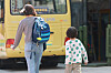 A parent and her child walk past a kindergarten in Gangnam District, southern Seoul, on April 7. [YONHAP]
