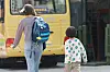 A parent and her child walk past a kindergarten in Gangnam District, southern Seoul, on April 7. [YONHAP]