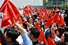 People wave Chinese flags as a plane carrying Chinese President Xi Jinping arrives at the Noi Bai International Airport in Hanoi, Vietnam, on April 14. [AP/YONHAP]