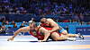Korean wrestler Lee Seung-chan, left, competes in the men’s Greco-Roman 130-kilogram repechage match against Amin Mirzazadeh of Iran at the Paris Olympics at Champ-de-Mars Arena in Paris on Tuesday. [YONHAP]