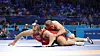 Korean wrestler Lee Seung-chan, left, competes in the men’s Greco-Roman 130-kilogram repechage match against Amin Mirzazadeh of Iran at the Paris Olympics at Champ-de-Mars Arena in Paris on Tuesday. [YONHAP]