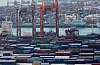 Containers are stakcked at a pier in the port city of Busan on Wednesday. [YONHAP]