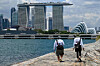 Anglers walk along a breakwater as the Marina Bay Sands and city skyline is seen from Marina East in Singapore on Oct. 14. [AFP/YONHAP]