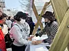 A tour participant touches 3D models of the National Assembly during Yeongdeungpo District's annual Spring Flower Festival in Yeouido, western Seoul, on April 8. [CHO JUNG-WOO]