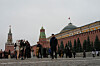 Tourists walk at Red Square with the Spasskaya Tower, left, and the Senate Palace behind the Kremlin Wall with a Presidential Standard atop, in Moscow on Dec. 2. [AP/YONHAP]