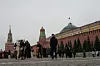 Tourists walk at Red Square with the Spasskaya Tower, left, and the Senate Palace behind the Kremlin Wall with a Presidential Standard atop, in Moscow on Dec. 2. [AP/YONHAP]