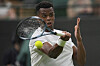 Giovanni Mpetshi Perricard of France returns the ball to Taylor Fritz of the United States during their first round men's single match at the Wimbledon Tennis Championships in London, June 30. [AP/YONHAP]