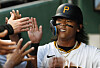 Pittsburgh Pirates center fielder Bae Ji-hwan high-fives in the dugout after scoring a run against the San Francisco Giants during the fifth inning at PNC Park in Pittsburgh on Tuesday.  [USA TODAY/YONHAP]