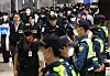 Korean nationals who were detained in Cambodia over their alleged involvement in online scams arrive at Incheon International Airport on Oct. 18. [YONHAP]