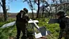 In this image made from video provided by Russian Defense Ministry Press Service on, May 27, Russian servicemen prepare to launch an interceptor drone for an action in an undisclosed location in Ukraine.