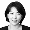 Black-and-white portrait of Park Su-ryon facing forward against a plain background.
