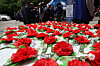 Carnations are handed out to older adults lined up at Love Car's free meal service station near a park in Dalseo District in Daegu on May 7, on the eve of Parents' Day. [YONHAP]