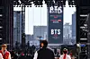 An advertisement promoting BTS’s upcoming comeback performance is displayed on a screen near Gwanghwamun Square in Jongno District, central Seoul, on March 19, two days ahead of the show. [KIM JONG-HO]