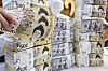 Won and dollar bills are stacked at Hana Bank's offices in Jung District, central Seoul, on April 17. [NEWS1]