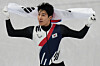 Korea's Hwang Dae-heon celebrates after winning a silver medal in the men's 1,500-meter final at the 2026 Milan-Cortina Winter Olympics in Milan on Feb. 14. [AP/YONHAP]