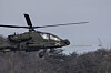 An AH-64E Apache attack helicopter fires a Hydra 70 rocket during a live-fire drill, conducted by Korean and U.S. forces, at Rodriguez fire range in Pocheon, north of Seoul, on Feb. 10, 2025. [YONHAP]