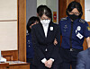 Kim Keon Hee, the wife of former President Yoon Suk Yeol, attends her first trial at the Seoul Central District Court in Seocho District, southern Seoul, on Sept. 24, 2025. She had been indicted and detained on charges including stock manipulation involving Deutsche Motors, political interference and taking bribes connected to the Unification Church. [JOINT PRESS CORPS]