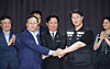 Labor Minister Kim Young-hoon, center, Samsung Electronics' management negotiator Yeo Myung-koo, left, and Choi Seung-ho, right, head of the Samsung Electronics chapter of the Samsung Group United Union, shake hands after signing a tentative wage agreement for 2026. [YONHAP]