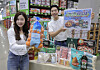 Models showcase globally sourced items at the Suwon Hwaseo branch of Traders Wholesale Club in Gyeonggi on March 19. [EMART]