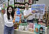 Models showcase globally sourced items at the Suwon Hwaseo branch of Traders Wholesale Club in Gyeonggi on March 19. [EMART]