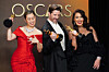 Maggie Kang, from left, Chris Appelhans, and Michelle L.M. Wong, winners of the award for animated feature film for Netflix's ″KPop Demon Hunters' (2025), pose in the press room at the Oscars on March 15 at the Dolby Theatre in Los Angeles. [AP/YONHAP]