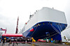 Guests pose for a group photo at the delivery ceremony of the Glovis Leader car carrier in Guangzhou, China, on April 28. [XINHUA/YONHAP]