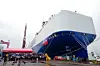 Guests pose for a group photo at the delivery ceremony of the Glovis Leader car carrier in Guangzhou, China, on April 28. [XINHUA/YONHAP]