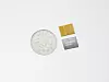 Samsung Electronics' next-generation 12-layer high bandwidth memory, HBM4E, right, next to a 500 won coin for scale [SAMSUNG ELECTRONICS]