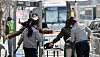 Passersby undergo security checks after passing through walk-through metal detectors near Gwanghwamun Square in Jongno District, central Seoul, ahead of BTS's comeback performance on March 21. [NEWS1]