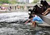 People sit along Cheonggyecheon in Jongno District, central Seoul, on June 1. [YONHAP]