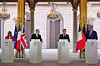 From left, Italian Prime Minister Giorgia Meloni, British Prime Minister Keir Starmer, French President Emmanuel Macron and German Chancellor Friedrich Merz deliver a joint statement following an international summit on efforts to reopen the Strait of Hormuz at the Elysee Palace in Paris on April 17. Korean President Lee Jae Myung took part in the summit through videoconference. [AFP/YONHAP]