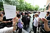 Voters look at their waiting tickets after being instructed to queue until extra ballots arrive at a polling station in Songpa District in southern Seoul on June 3. [YONHAP]