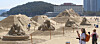 People look at sand sculptures on Haeundae Beach in Busan on May 11, as part of the 2026 Haeundae Sand Festival, which is set to exhibit 17 works that depict the history, culture and major landmarks of Korea's southeastern port city from May 15 to 18. [NEWS1]