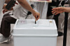 An eligible voter puts their ballots inside the ballot box while voting for the 2026 local elections at a polling station in Dongjak District, southern Seoul, on June 3. [YONHAP]