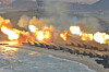 The North Korean military is seen firing artillery during a training session on June 17, 2018, in this photo released by the Korean Central News Agency. [YONHAP