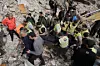 Rescuers carry a dead body retrieved from under the rubble of a destroyed building, struck in Israeli airstrikes in the city of Tyre, southern Lebanon, on April 18. [AP/YONHAP]