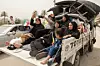 Displaced people make their way back to their homes after crossing the bridge linking southern Lebanon to the rest of the country, which was hit earlier in an Israeli strike, after a 10-day ceasefire between Lebanon and Israel went into effect, in Qasmiyeh, Lebanon, April 18. [REUTERS/YONHAP]