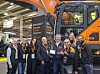 HD Construction Equipment employees pose for a photo with the SaMoTer Innovation Award, recognized by its AI-powered smart safety technology. [HD CONSTRUCTION EQUIPMENT]