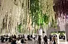 Visitors are seen taking rest at an underground plaza at Centum City in Busan in March. [YONHAP]