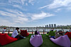 People relax along Jamsu Bridge in Seocho District, southern Seoul, as the 2026 car-free Jamsu Bridge walking festival takes place on April 26, with temperatures hovering around 25 degrees Celsius (77 degrees Fahrenheit) and early summer weather settling over the city. [NEWS1]