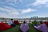 People relax along Jamsu Bridge in Seocho District, southern Seoul, as the 2026 car-free Jamsu Bridge walking festival takes place on April 26, with temperatures hovering around 25 degrees Celsius (77 degrees Fahrenheit) and early summer weather settling over the city. [NEWS1]