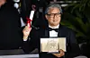 Korean director Park Chan-wook poses with an award plaque after winning Best Director at the Cannes International Film Festival in Cannes, France, on May. 29, 2022. [NEWS1]