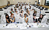 International students hold up their brush calligraphy works during a traditional calligraphy experience session at the “2025 Pusan National University Summer School,” held on July 9, 2025 at Pusan National University in Geumjeong District, Busan.